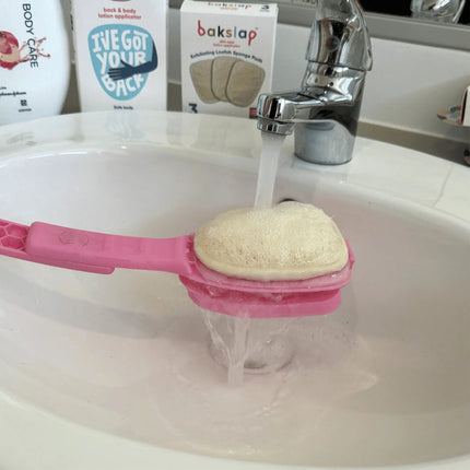 Bakslap Loofah Sponge on applicator in use