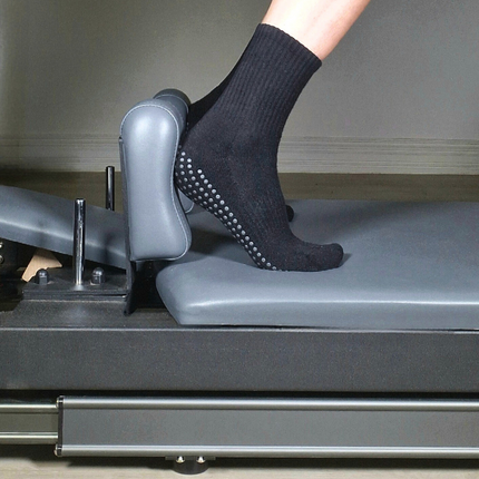 GripperzSocks Ink crew grip socks on reformer