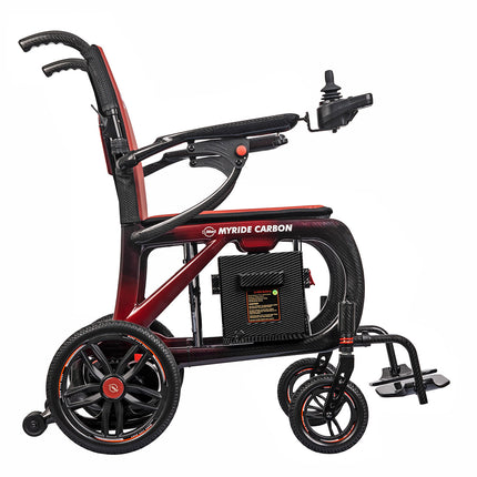 A MYRIDE CARBON electric wheelchair with a black and dark red frame, featuring a carbon-fiber textured seat, black wheels with red accents, and a joystick control on the right side, shown against a plain white background.