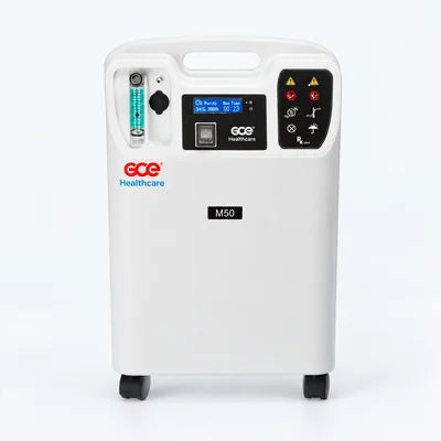 GCE M50 5L stationary oxygen concentrator on a pale studio background